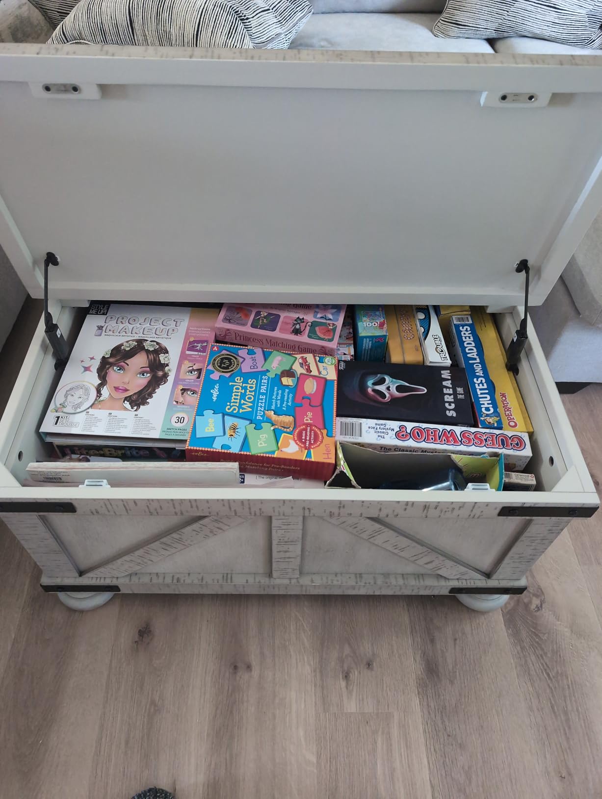 Signature Design by Ashley Coffee Table, Square Farmhouse with Storage | Rustic distressed finish, Lift-top hidden storage, Hidden casters for mobility, Living room use, Carynhurst Series customer photo 1
