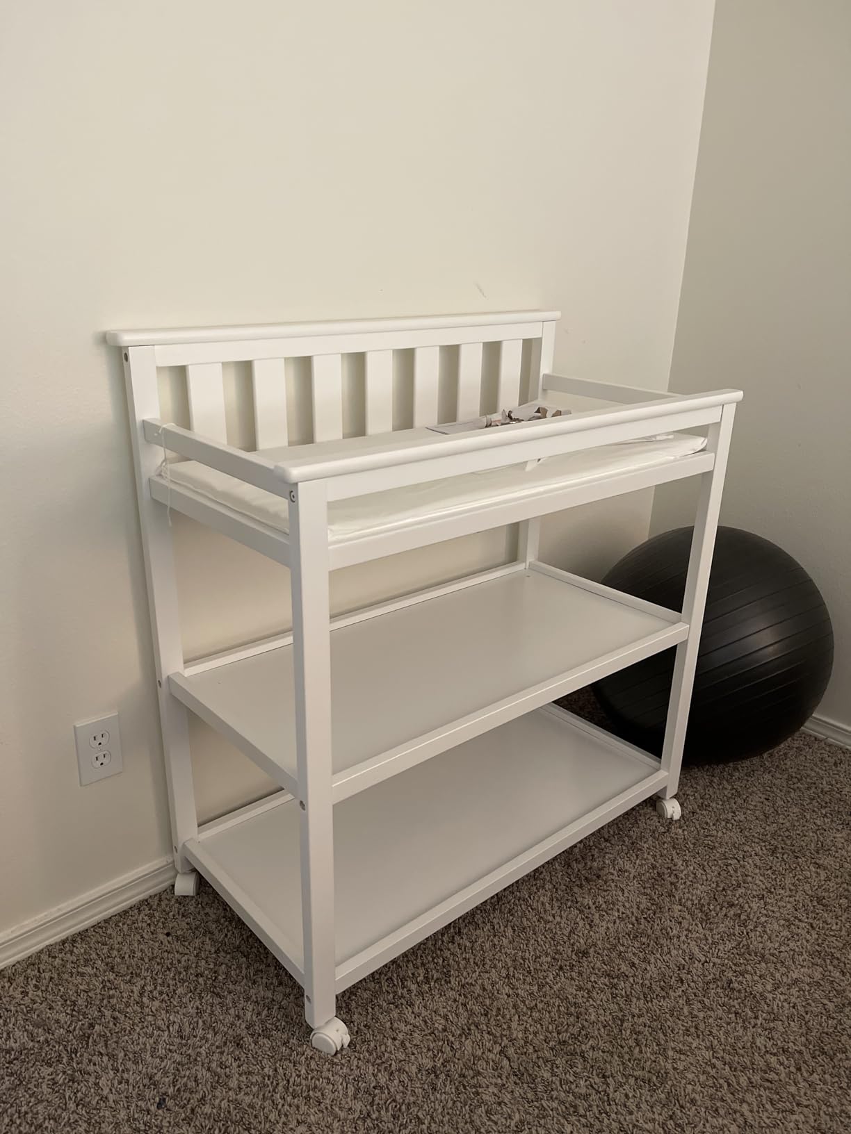 Delta Children Flat Top Changing Table with Wheels and Changing Pad - Greenguard Gold Certified, Bianca White customer photo 1