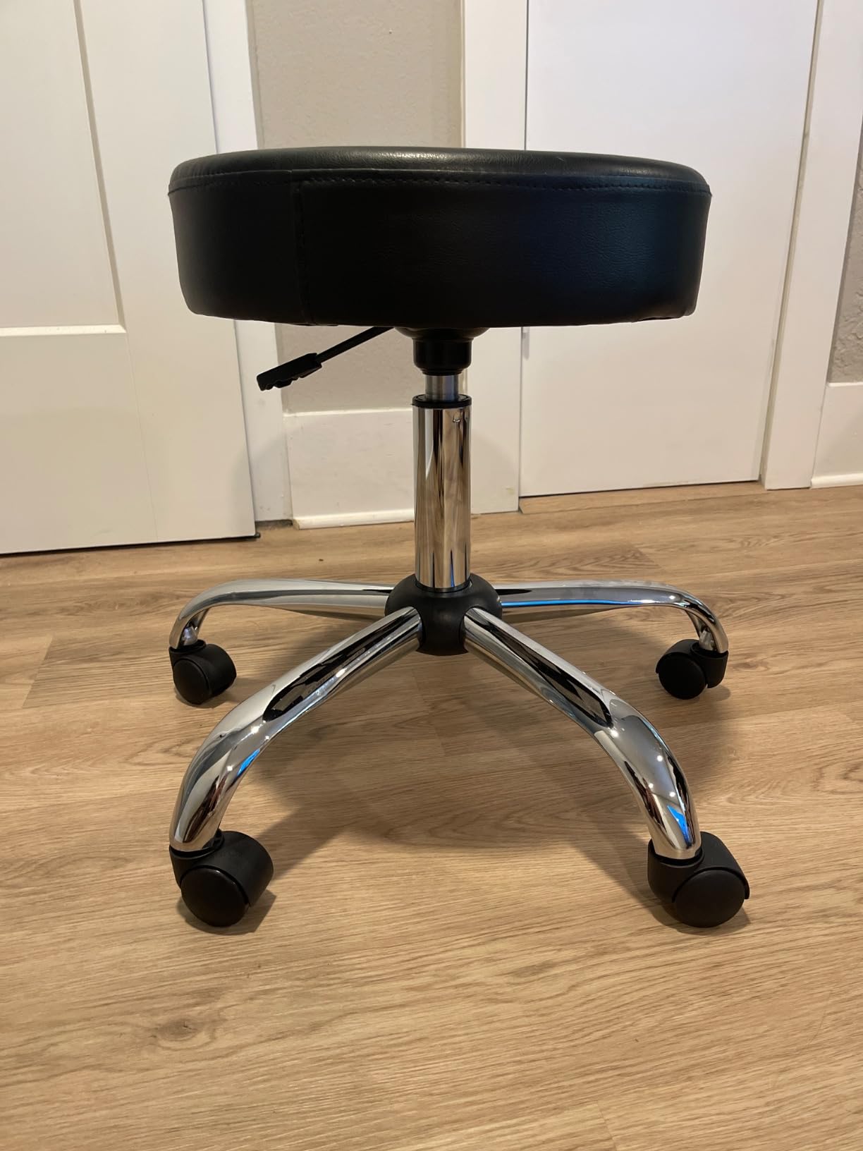 Amazon Basics Drafting Spa Bar Stool with Wheels, Height Adjustable Swivel Seat, Easy to Move, Black, 22.05