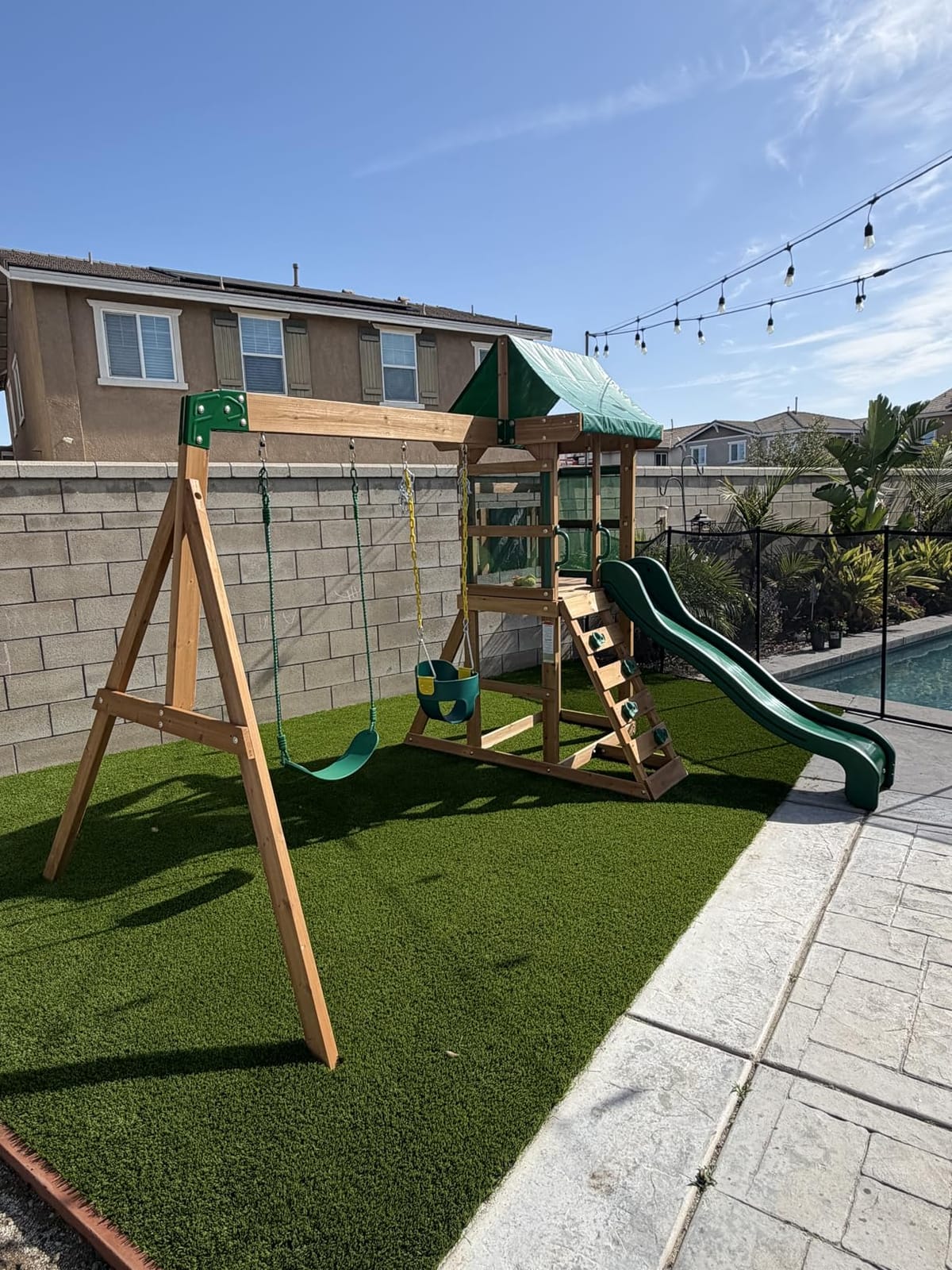 Backyard Discovery Buckley Hill Cedar Wood Swing Set with Wave Slide, Play Deck, Rock Wall Ladder, Belt Swings, Chalkboard, Canopy Roof, Outdoor Playset customer photo 2
